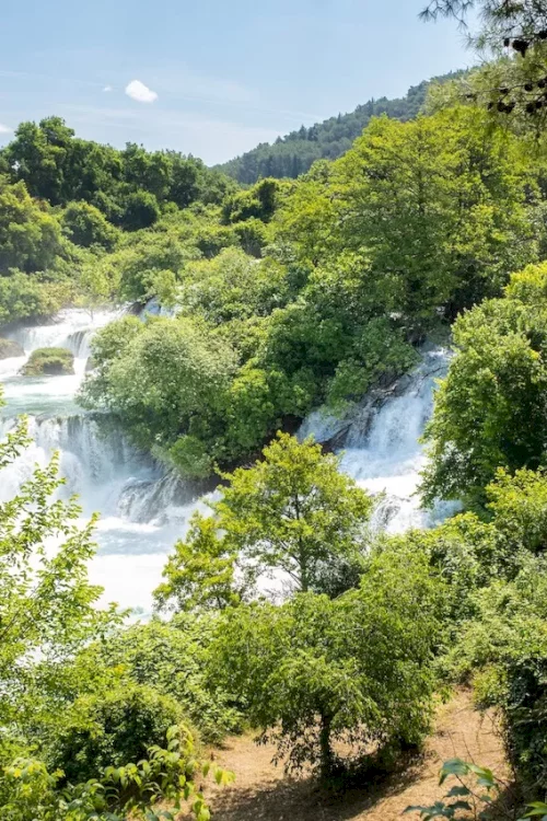 krka-waterfalls-house-in-greenery